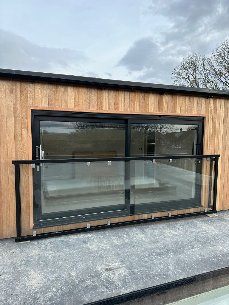 glass balcony on wooden building